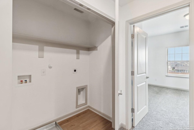 laundry room with laundry area, baseboards, gas dryer hookup, hookup for an electric dryer, and washer hookup