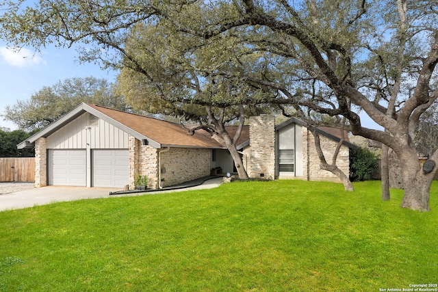 mid-century inspired home featuring concrete driveway, an attached garage, fence, a front lawn, and board and batten siding