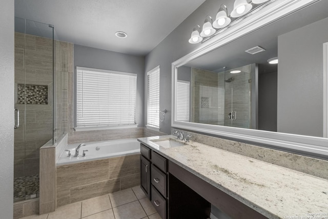 full bath with vanity, visible vents, a bath, tile patterned floors, and a stall shower