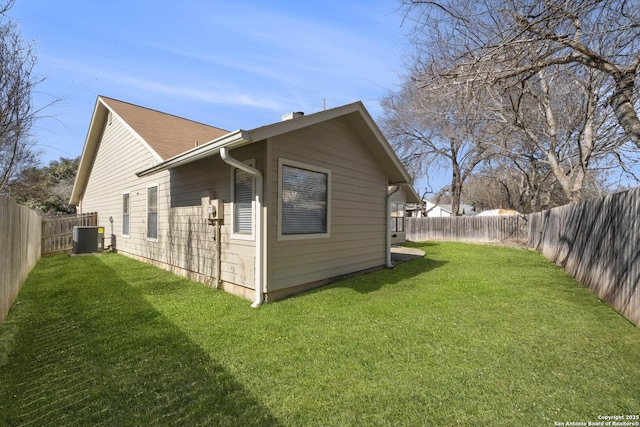 view of property exterior with a yard, central AC unit, and a fenced backyard