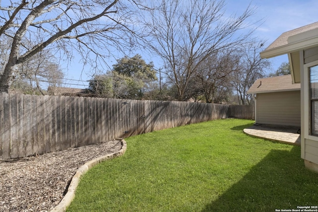 view of yard with a fenced backyard