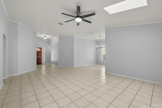 spare room with light tile patterned floors, ceiling fan with notable chandelier, a skylight, visible vents, and crown molding