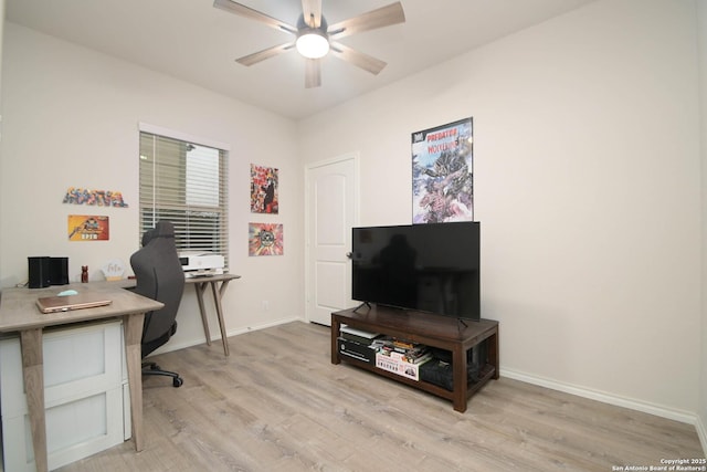 office with light wood-type flooring, ceiling fan, and baseboards