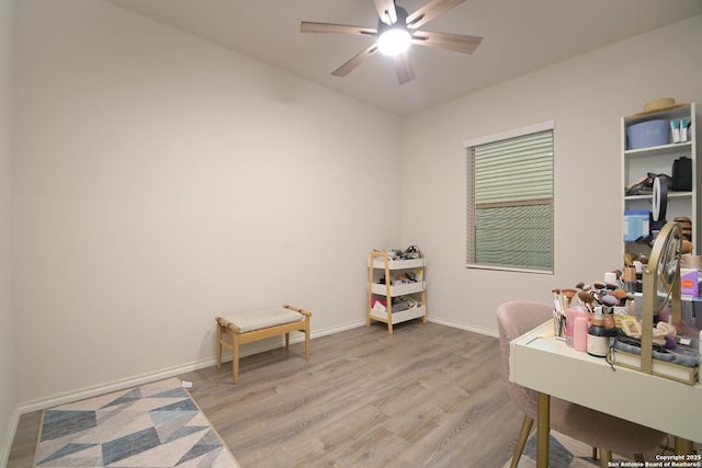 home office featuring ceiling fan, baseboards, and wood finished floors