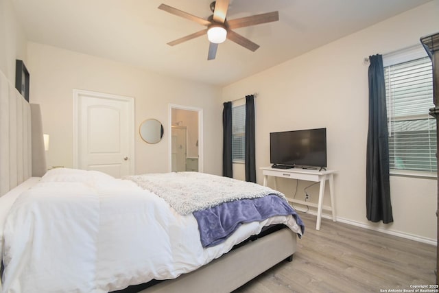 bedroom with light wood finished floors, baseboards, and a ceiling fan