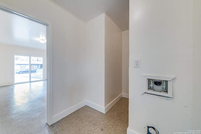 corridor with light floors and baseboards