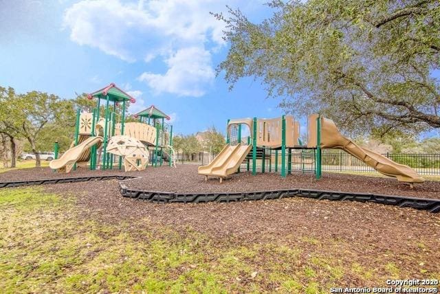 community jungle gym with fence