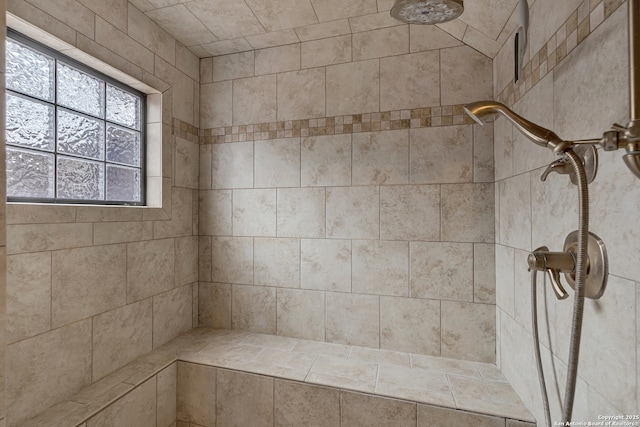 full bath featuring a tile shower