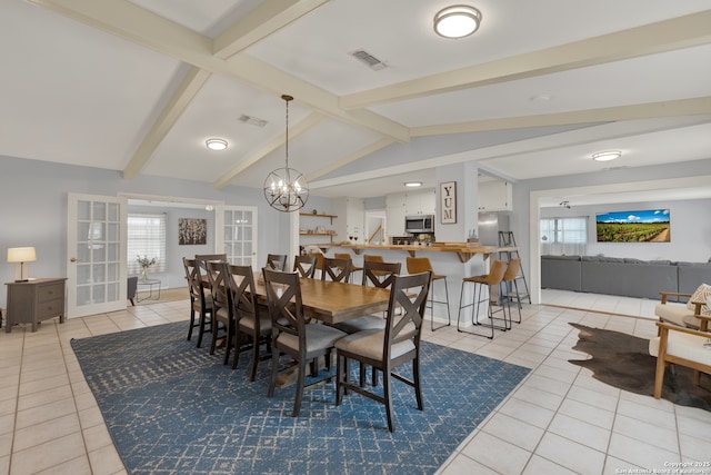 dining room featuring visible vents, plenty of natural light, lofted ceiling with beams, and light tile patterned flooring