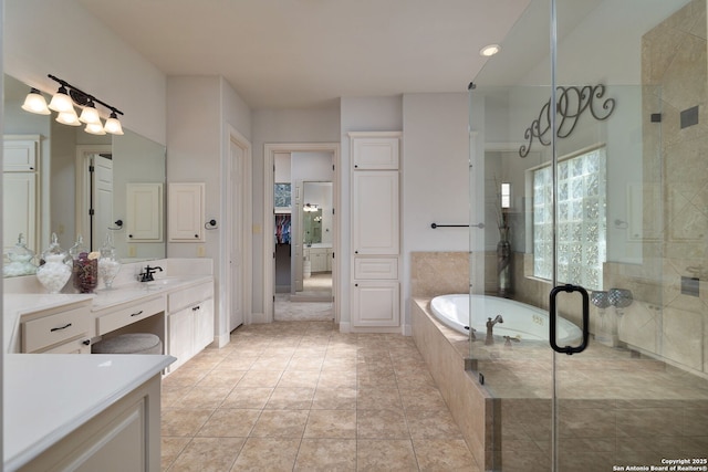 bathroom with tiled shower, tile patterned floors, a garden tub, vanity, and a closet