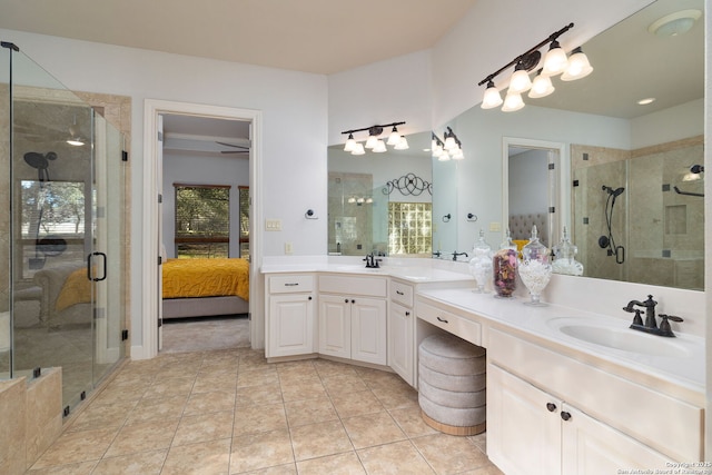 full bathroom featuring plenty of natural light, a sink, a shower stall, and ensuite bath