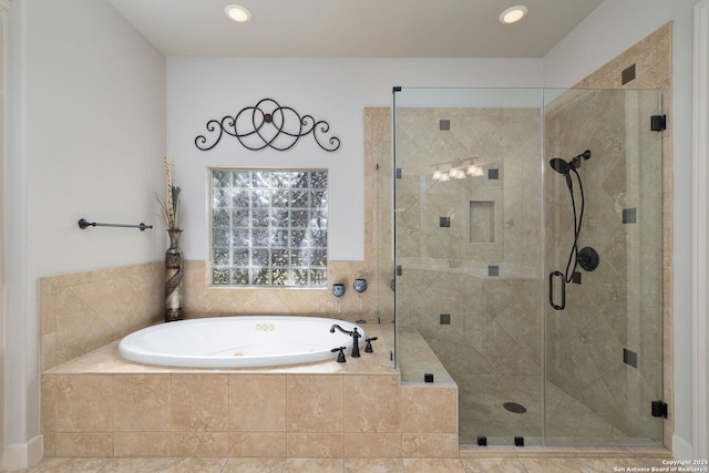 bathroom with a garden tub, recessed lighting, and a stall shower