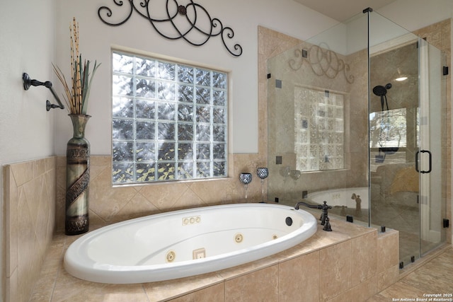 full bath featuring a tub with jets and a shower stall