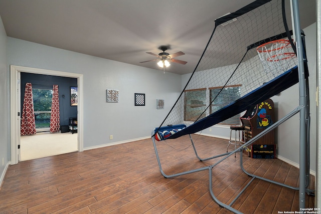 game room with wood-type flooring, baseboards, and a ceiling fan