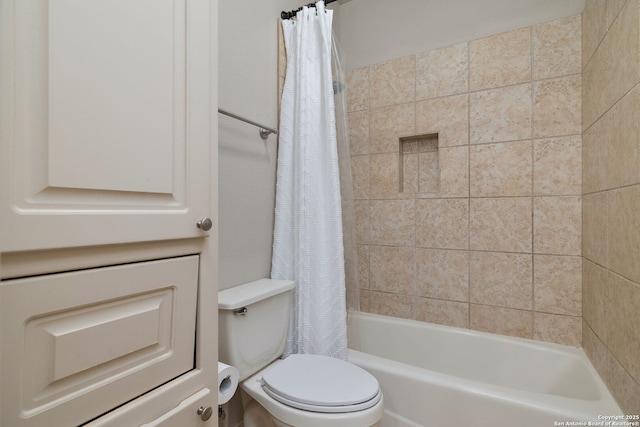 bathroom featuring toilet and shower / tub combo with curtain