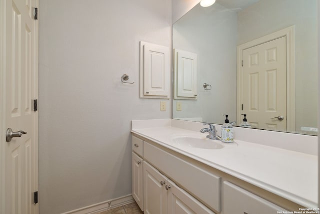 bathroom with vanity and baseboards