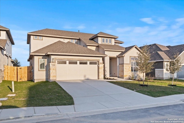 view of front facade featuring a front lawn, concrete driveway, fence, and an attached garage