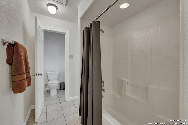 full bathroom with shower / bath combination with curtain, toilet, a textured ceiling, tile patterned flooring, and baseboards