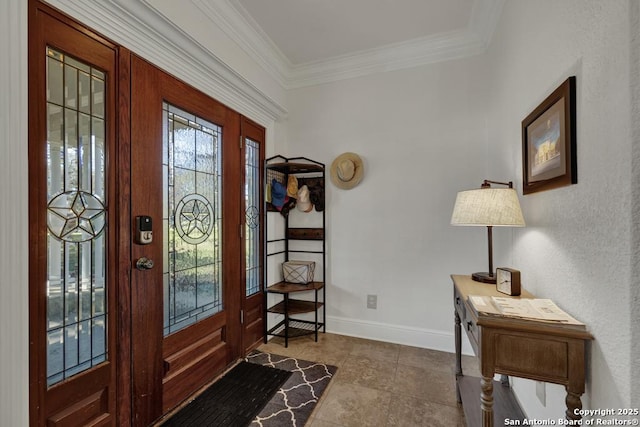 foyer with baseboards and crown molding