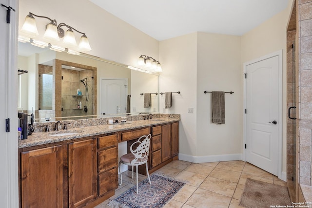 bathroom featuring tile patterned flooring, a sink, a shower stall, and double vanity