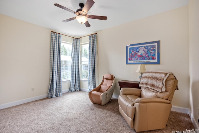 living area featuring a ceiling fan, carpet flooring, and baseboards