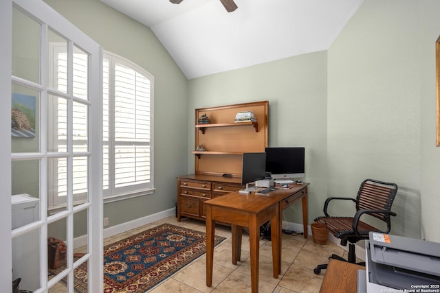 office area featuring lofted ceiling, ceiling fan, light tile patterned floors, and plenty of natural light