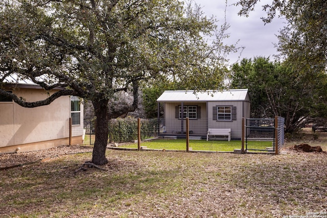 view of yard with a fenced front yard and a gate