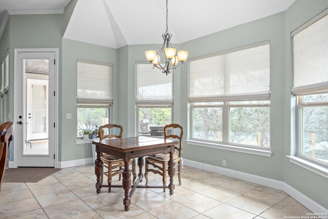 dining room with lofted ceiling, an inviting chandelier, light tile patterned floors, and baseboards