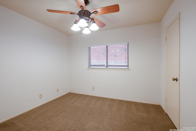 empty room featuring light carpet, ceiling fan, and a textured ceiling