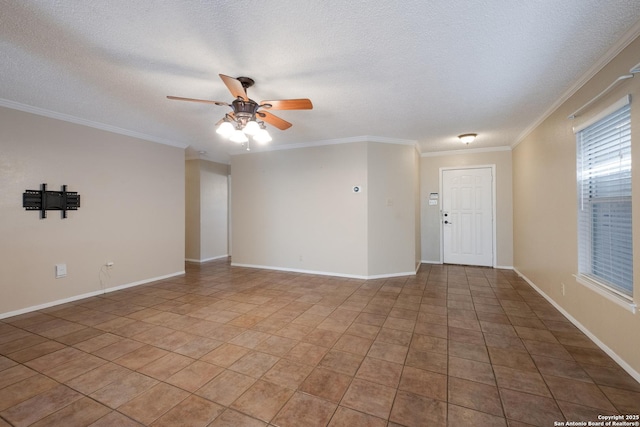 unfurnished room featuring a textured ceiling, ornamental molding, and a ceiling fan