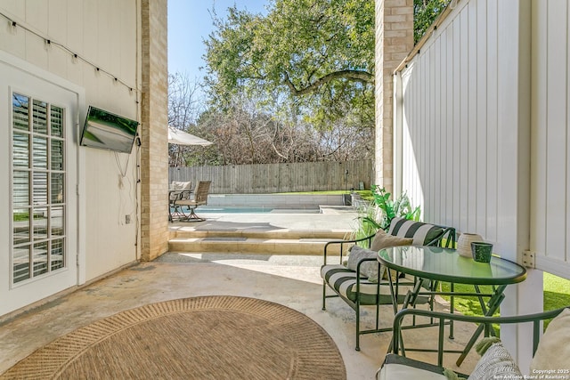 view of patio with fence