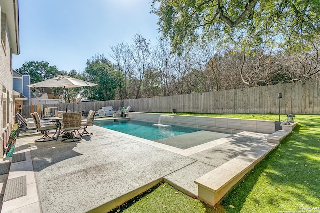 view of swimming pool with a fenced backyard, a lawn, a fenced in pool, and a patio