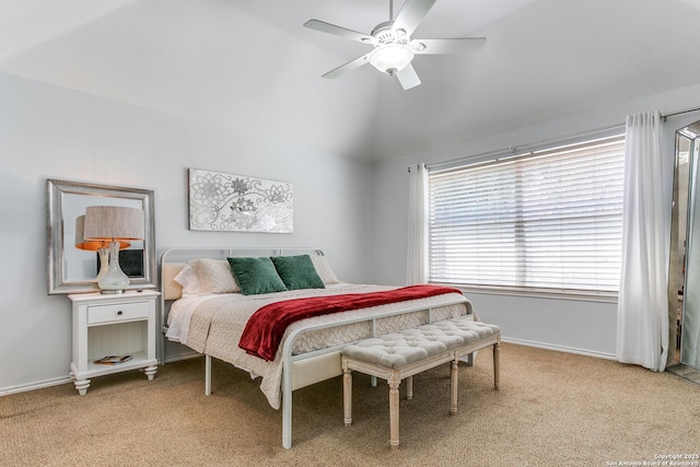 bedroom featuring lofted ceiling, ceiling fan, baseboards, and light colored carpet