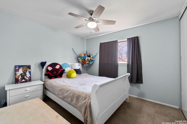 bedroom with carpet flooring, a ceiling fan, and baseboards