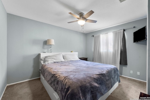 bedroom with carpet, ceiling fan, and baseboards