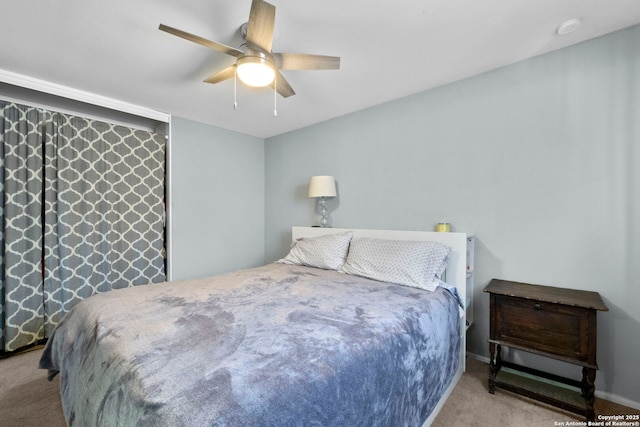 carpeted bedroom with a ceiling fan