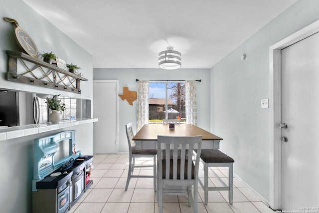 dining room with light tile patterned flooring