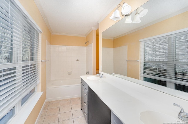 bathroom with ornamental molding, tile patterned flooring, a sink, and double vanity