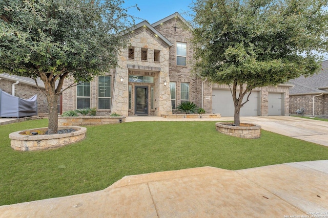 view of front facade with brick siding, an attached garage, stone siding, driveway, and a front lawn