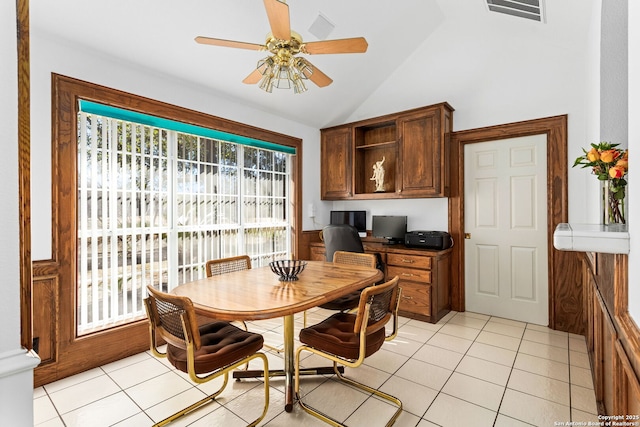 dining area with lofted ceiling, light tile patterned flooring, visible vents, a ceiling fan, and built in desk