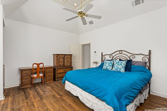 bedroom featuring lofted ceiling, a ceiling fan, visible vents, and wood finished floors