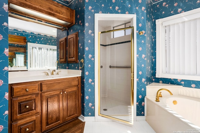 full bath featuring wallpapered walls, baseboards, vanity, a shower stall, and a bath