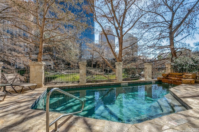 view of pool with fence