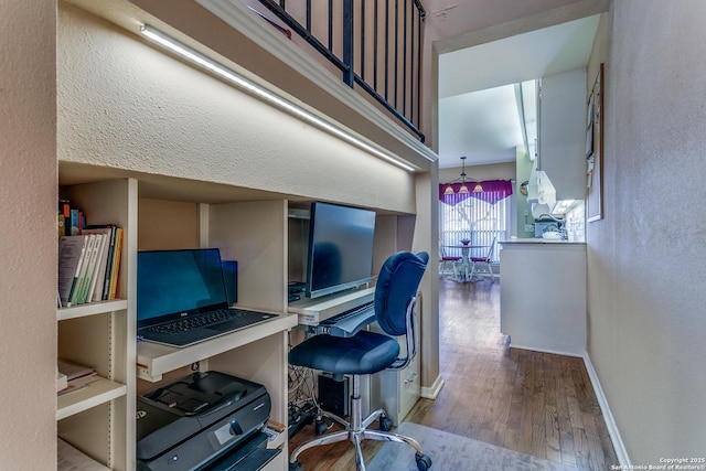 office with baseboards and hardwood / wood-style floors