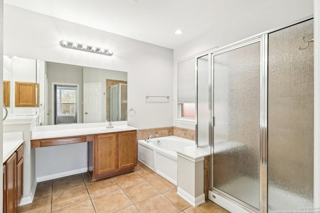 bathroom featuring a bath, tile patterned flooring, vanity, and a shower stall