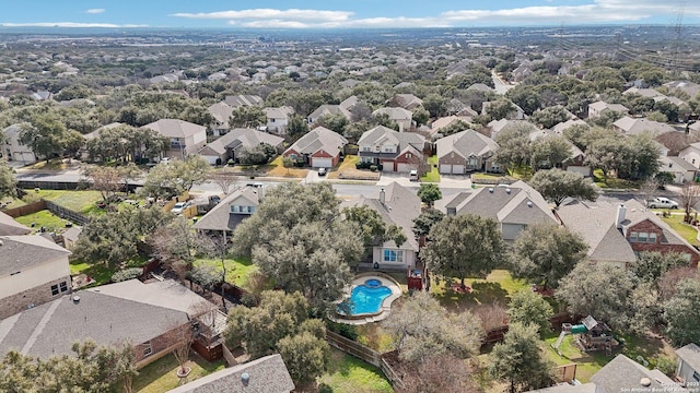 birds eye view of property with a residential view