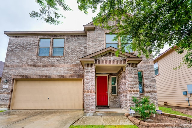 view of front of home with brick siding, driveway, and an attached garage