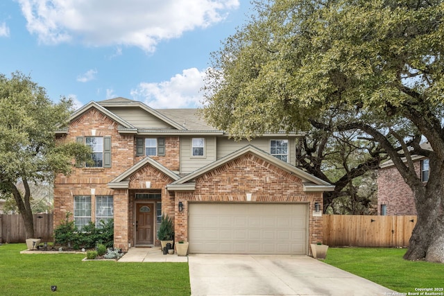 view of front of house featuring brick siding, fence, and driveway