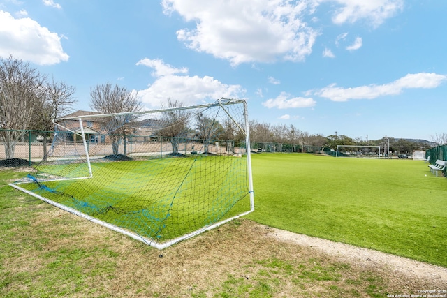 view of property's community with fence