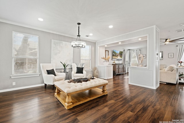 living area featuring recessed lighting, crown molding, baseboards, and wood finished floors